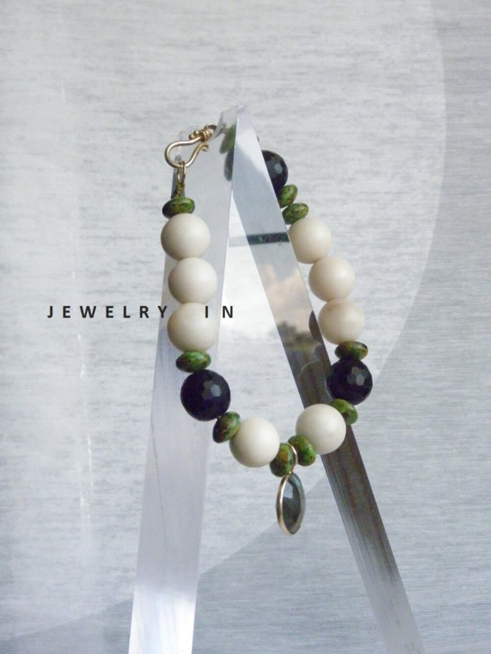 White river stone with black onyx and sterling silver pendant bracelet